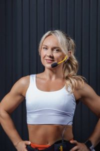 Fitness instructor wearing a professional wireless headset microphone and bodypack